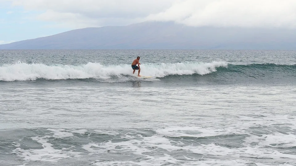 A surfer riding waves