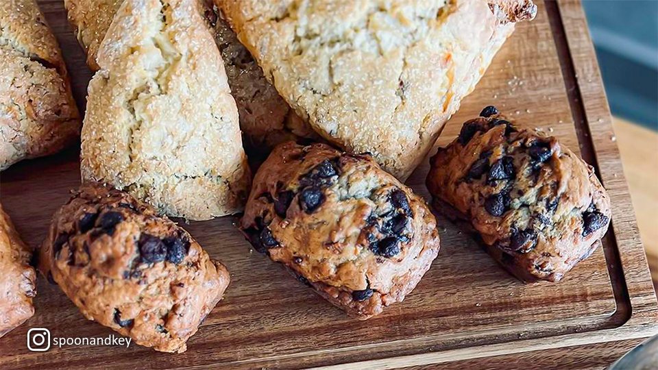 Assortment of baked goods at Spoon & Key Market, including pastries and breads displayed on a counter.