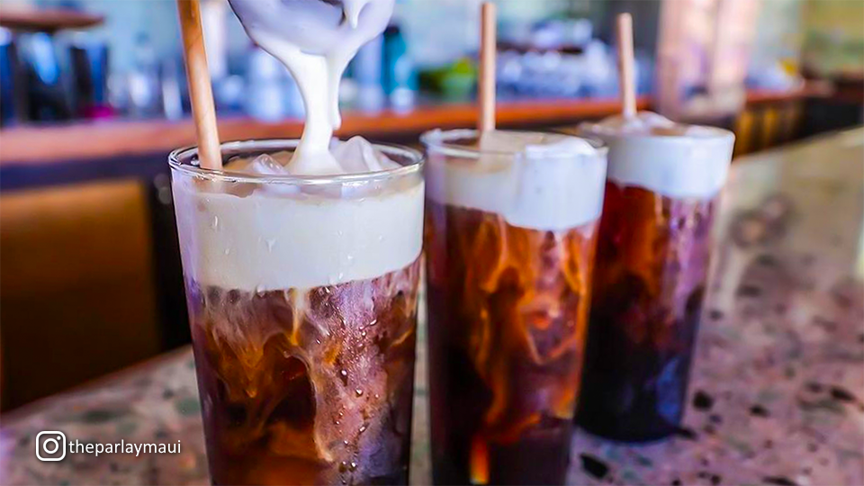 Refreshing drink float at The Parlay, served in a tall glass with layers of ice cream and soda.