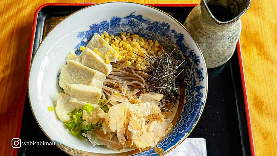 Delicate bowl of cold soba noodles at Wabisabi Soba & Sushi, served with a side of tempura and dipping sauce.