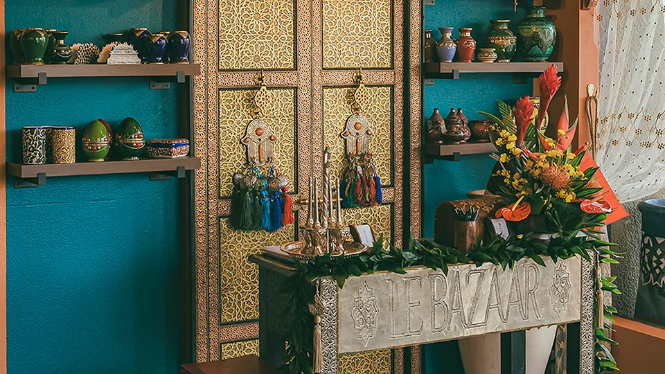 Check-in counter at Le Bazaar Maui with a welcoming setup and Moroccan-inspired decor.