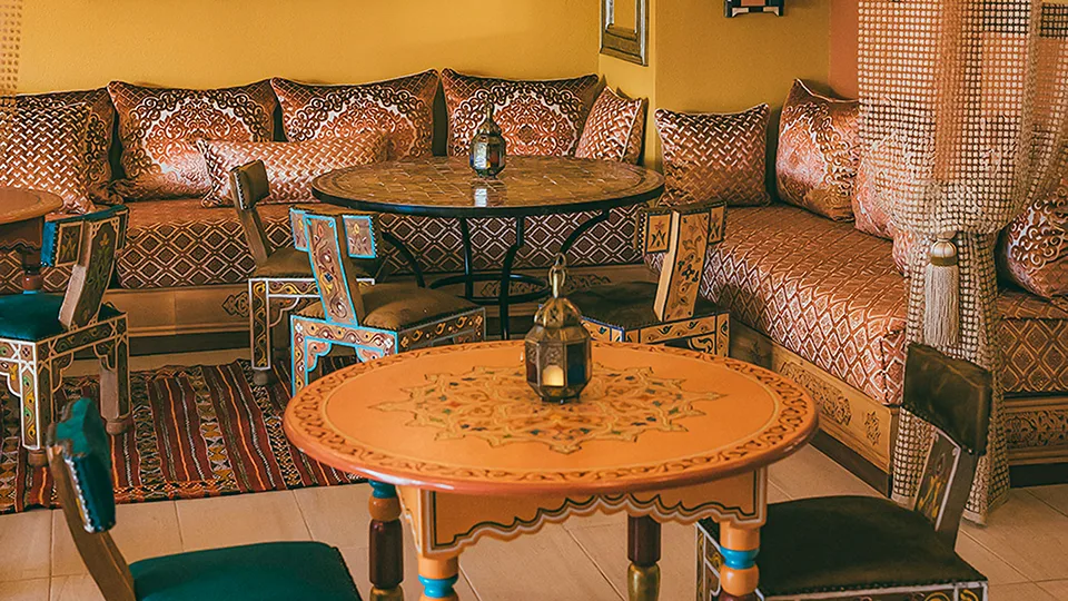 Interior of Le Bazaar Maui, featuring elegant Moroccan decor and warm lighting.