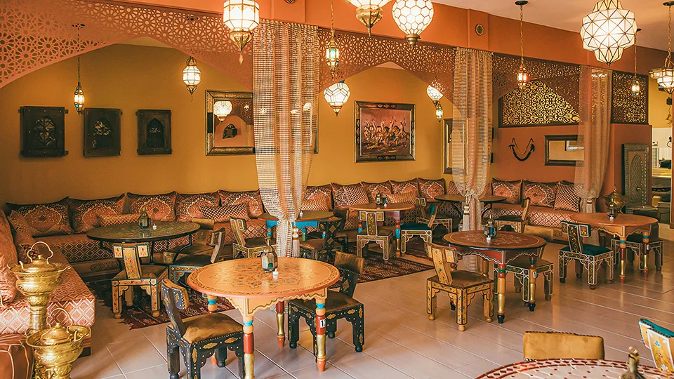 Spacious dining area at Le Bazaar Maui with stylish seating and a Moroccan-inspired atmosphere.