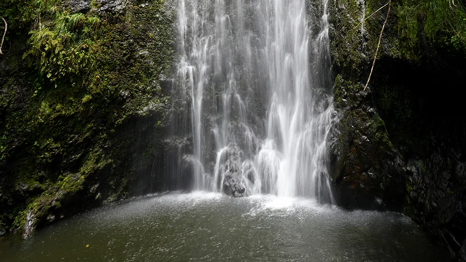 Close-up of Wailua Falls showing water patterns and plunge pool off Road to Hana Maui