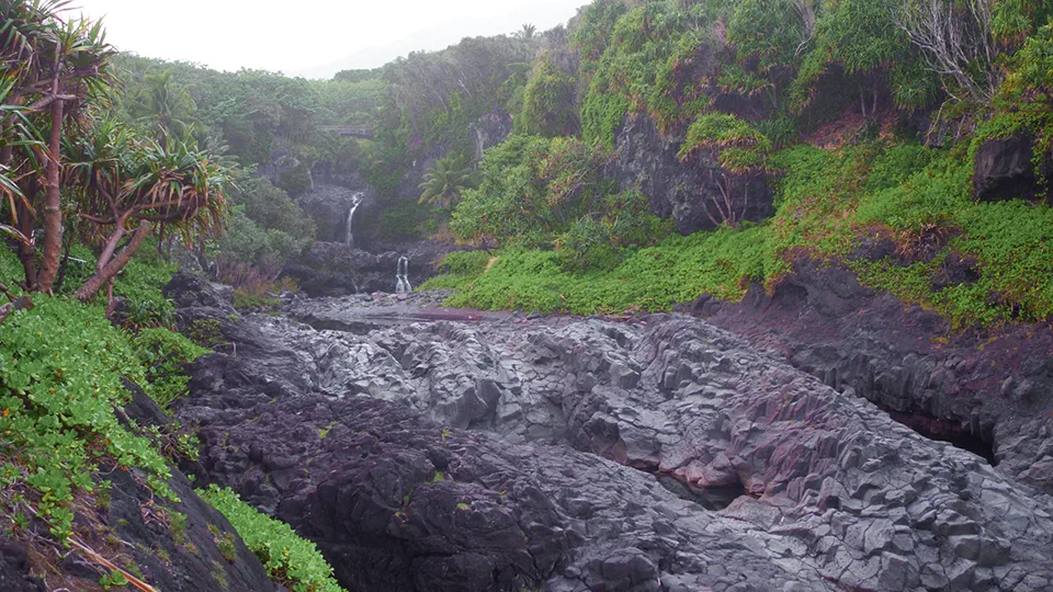 Valley view of 'Ohe'o Gulch with multiple waterfalls and pools in Haleakala National Park