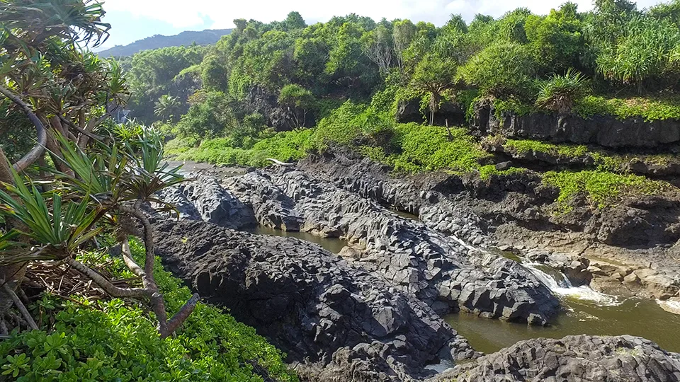 Panoramic view of 'Ohe'o Gulch pools and waterfalls flowing toward ocean in Haleakala National Park