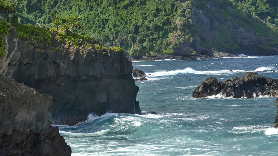 Coastal view of 'Ohe'o Gulch Seven Sacred Pools flowing into Pacific Ocean in Kipahulu Maui